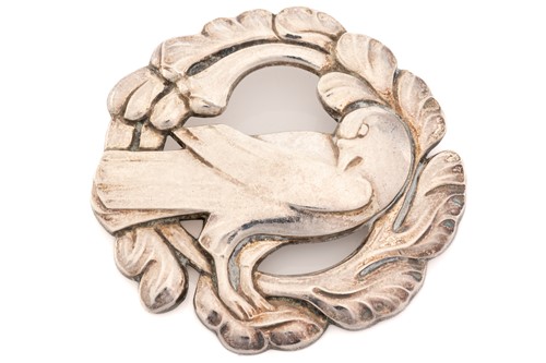 Lot 332 - Georg Jensen - A brooch depicting dove in...