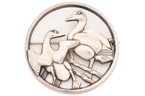 Lot 325 - Georg Jensen - A circular brooch pierced and...