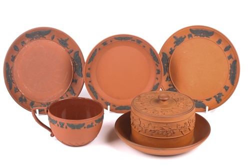 Lot 204 - A Wedgwood rosso antico large cup and saucer,...