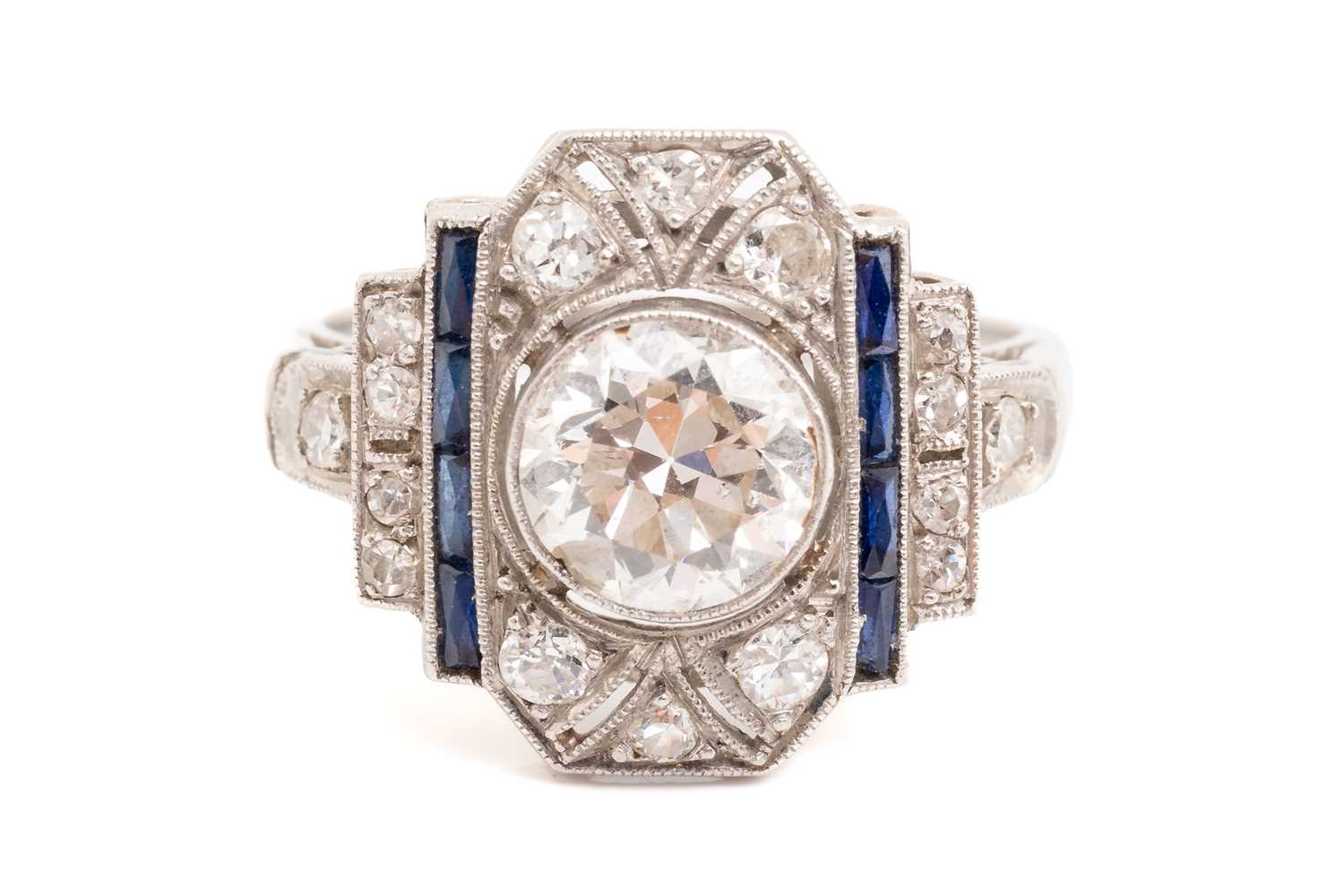 Lot 20 - An Art Deco diamond sapphire panel ring,...