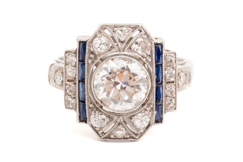 Lot 20 - An Art Deco diamond sapphire panel ring,...