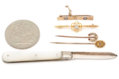 Lot 109 - A three stone sapphire and diamond bar brooch;...