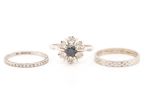 Lot 47 - A sapphire and diamond cluster ring and two...
