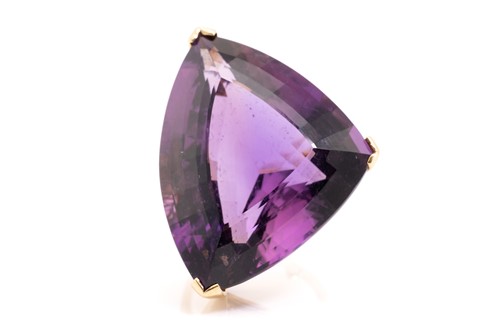 Lot 8 - A large amethyst cocktail ring, featuring a...