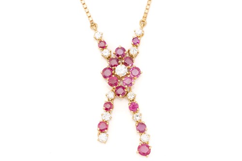 Lot 82 - A diamond and ruby pendant; comprising a...