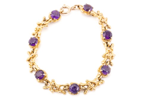 Lot 60 - A seven stone amethyst bracelet, the circular...