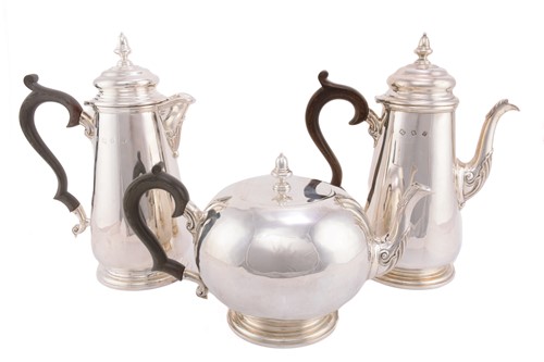 Lot 529 - A matched three piece silver tea set, London...