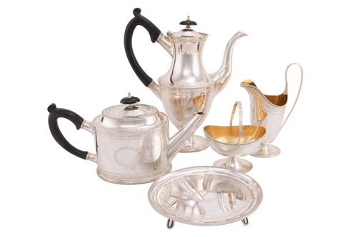 Lot 522 - A matched five-piece silver tea set, London...