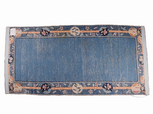 Lot 266 - A Chinese Peking blue ground rug, late Qing,...