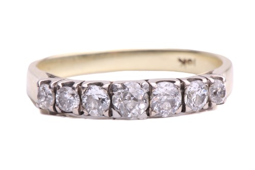 Lot 14 - A seven stone half hoop ring; the slightly...