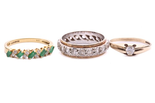 Lot 45 - Three gem-set rings in gold; to include an...