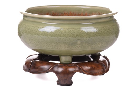 Lot 114 - A Chinese celadon circular censer with diaper...