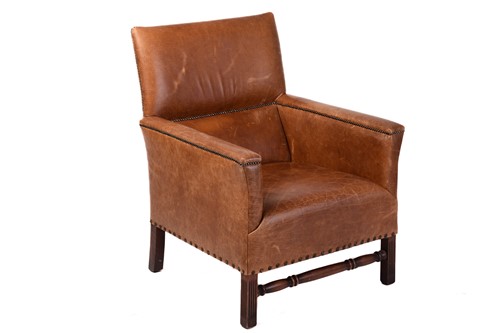 Lot 212 - A deep-seated distressed tan leather-covered...