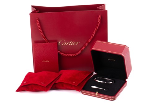 Lot 179 - Cartier - An 18ct white gold and diamond 'Love'...