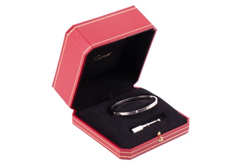 Lot 179 - Cartier - An 18ct white gold and diamond 'Love'...