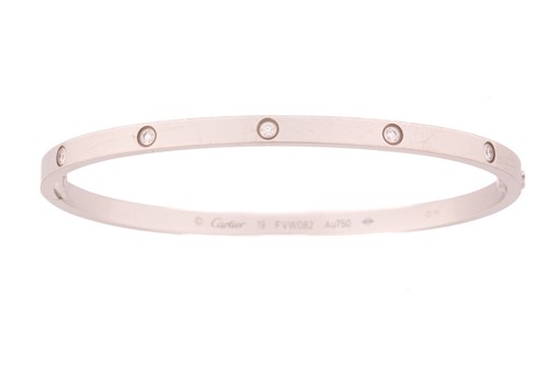 Lot 179 - Cartier - An 18ct white gold and diamond 'Love'...
