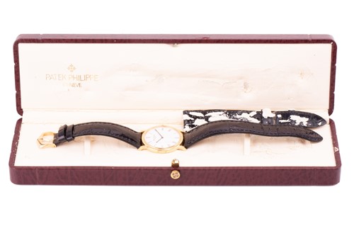 Lot 345 - A Patek Philippe Calatrava 18k yellow gold...