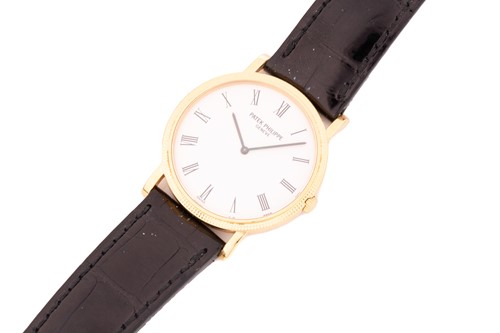 Lot 345 - A Patek Philippe Calatrava 18k yellow gold...