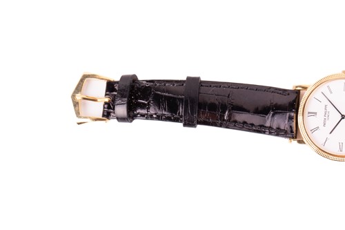 Lot 345 - A Patek Philippe Calatrava 18k yellow gold...