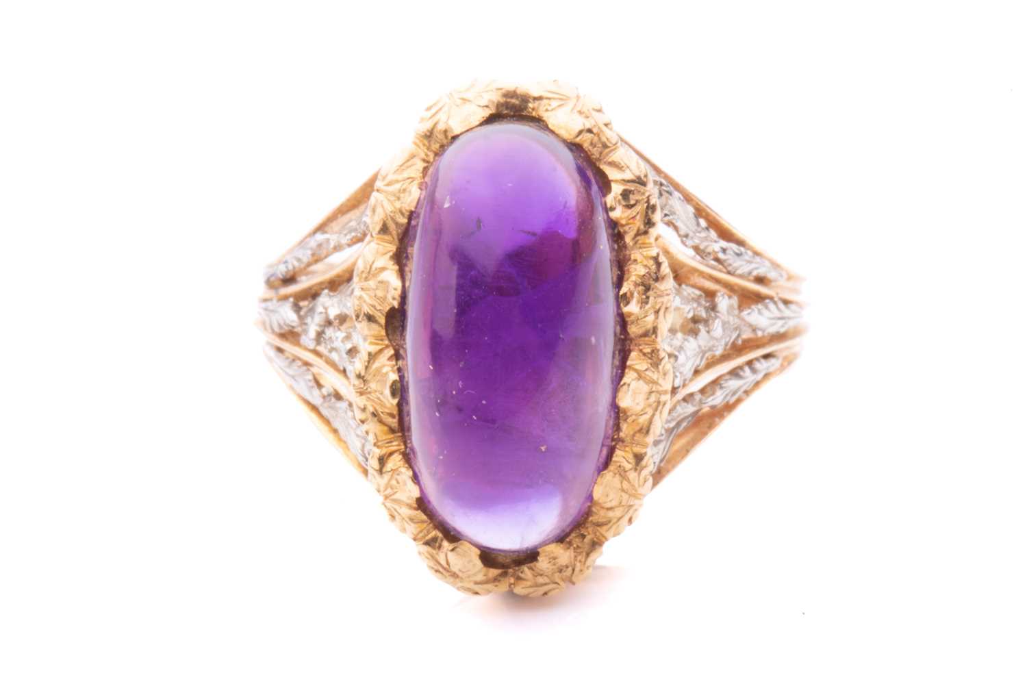 Lot 200 - An amethyst cabochon dress ring of foliate...