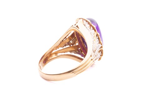 Lot 200 - An amethyst cabochon dress ring of foliate...