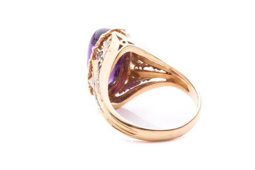 Lot 200 - An amethyst cabochon dress ring of foliate...