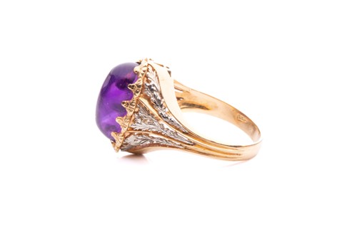 Lot 200 - An amethyst cabochon dress ring of foliate...