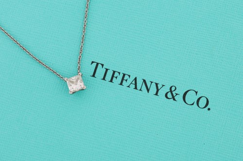 Lot 10 - Tiffany & Co. - a princess-cut solitaire...