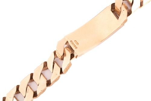 Lot 77 - A heavy 9ct yellow gold ID bracelet,...