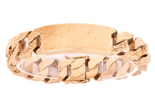 Lot 77 - A heavy 9ct yellow gold ID bracelet,...