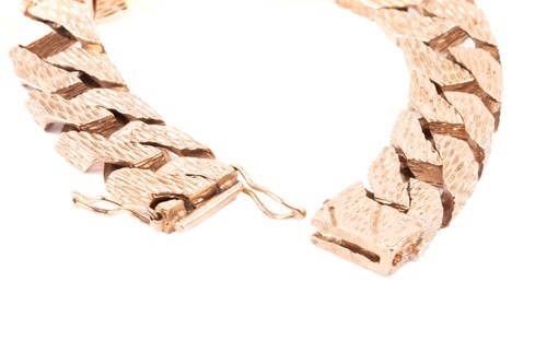 Lot 77 - A heavy 9ct yellow gold ID bracelet,...