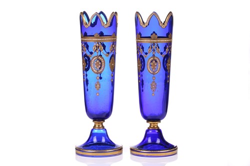 Lot 304 - A pair of blue glass and gilt-decorated vases,...