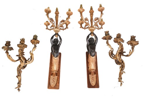 Lot 223 - A pair of French ormolu rococo three-sconce...
