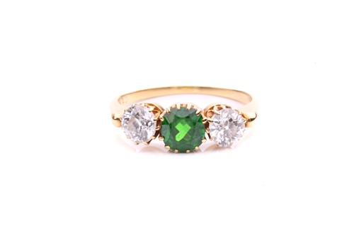 Lot 26 - A tsavorite and diamond three-stone ring,...