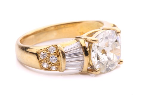 Lot 54 - A diamond dress ring, claw-set with an old-cut...