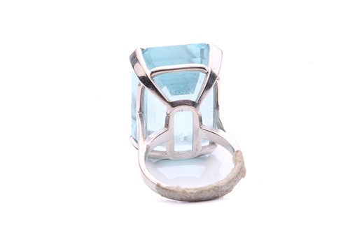 Lot 5 - A large aquamarine solitaire ring, claw-set...