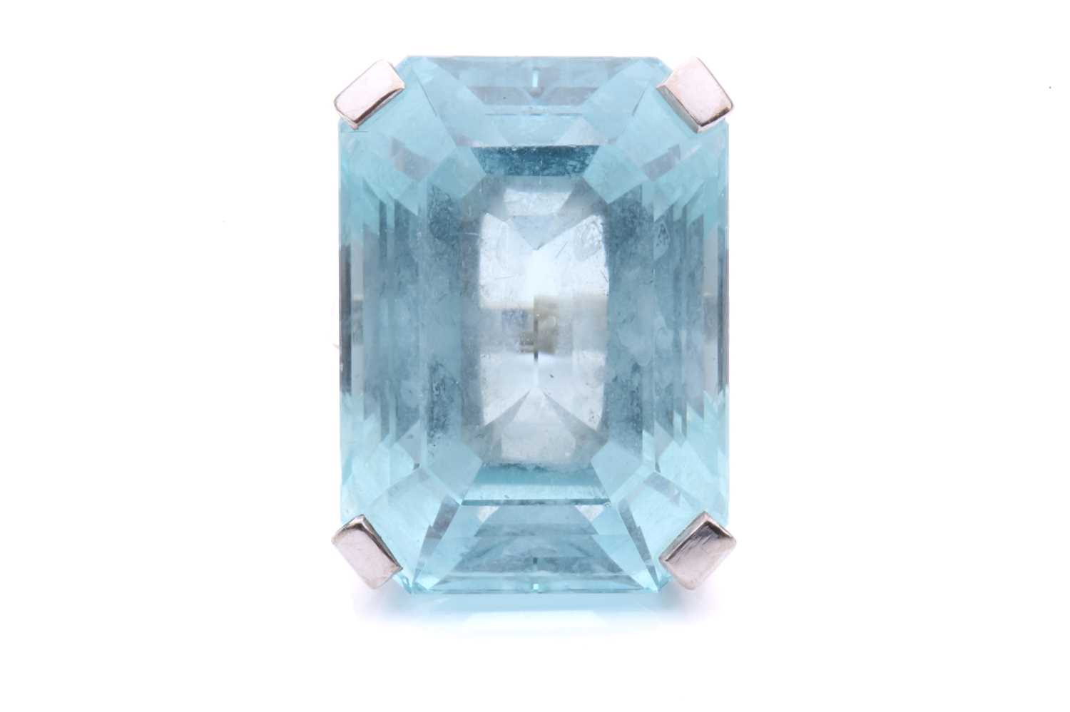 Lot 5 - A large aquamarine solitaire ring, claw-set...