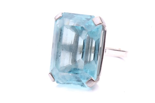 Lot 5 - A large aquamarine solitaire ring, claw-set...