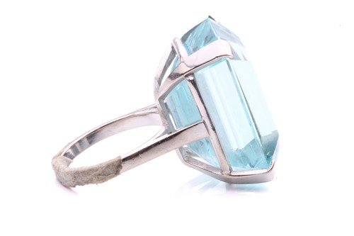 Lot 5 - A large aquamarine solitaire ring, claw-set...