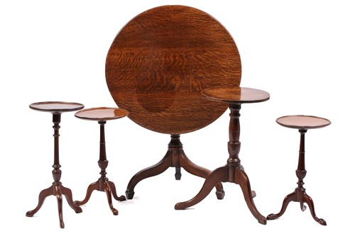 Lot 224 - A George III vernacular oak tripod candle...