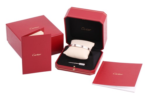 Lot 32 - Cartier - a 'LOVE' bangle in 18ct white gold,...