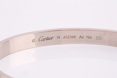 Lot 32 - Cartier - a 'LOVE' bangle in 18ct white gold,...