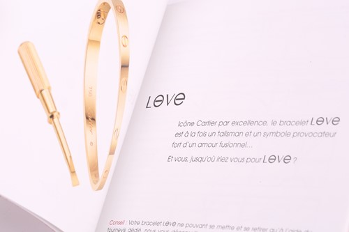 Lot 32 - Cartier - a 'LOVE' bangle in 18ct white gold,...