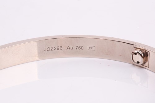 Lot 32 - Cartier - a 'LOVE' bangle in 18ct white gold,...