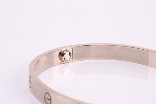 Lot 32 - Cartier - a 'LOVE' bangle in 18ct white gold,...