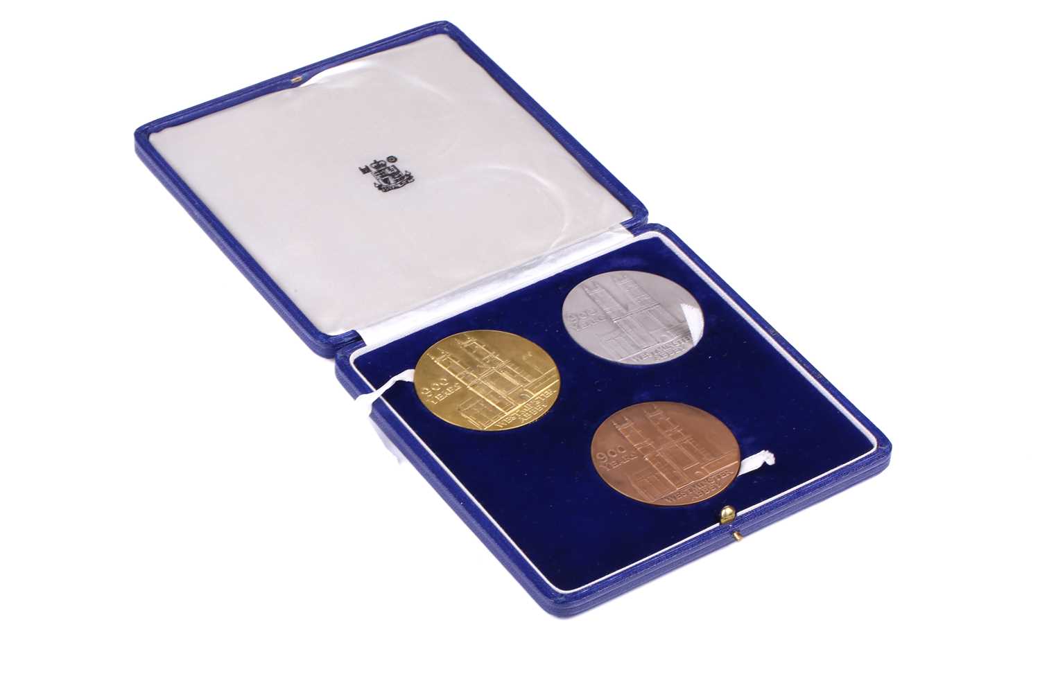 Lot 339 - A Royal Mint commemorative three-medal set:...