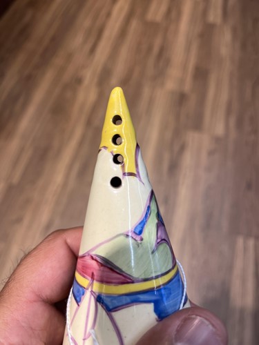 Lot 125 - A 1930s Clarice Cliff conical sugar sifter, in...