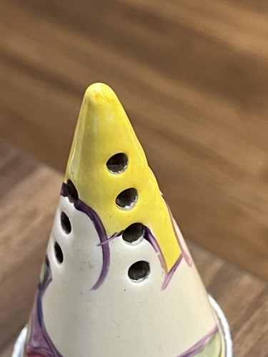 Lot 125 - A 1930s Clarice Cliff conical sugar sifter, in...