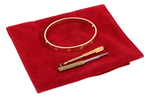 Lot 199 - Cartier - a 'LOVE' bangle, composed of two...