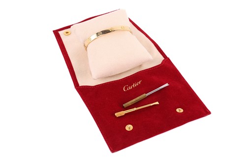 Lot 199 - Cartier - a 'LOVE' bangle, composed of two...